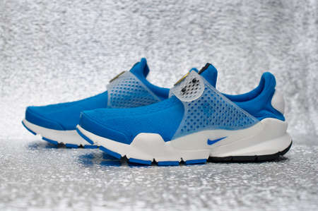 Nike Sock Dart running shoes, sneakers, trainers close up view, shot on silver metallic background. Sport and casual footwear concept. Krasnoyarsk, Russia - January 15, 2016のeditorial素材