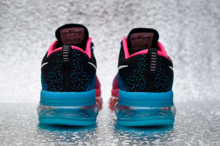 Nike Flyknit Air Max running shoes, sneakers, trainers close up view, shot on silver metallic background. Sport and casual footwear concept. Krasnoyarsk, Russia - January 15, 2016のeditorial素材