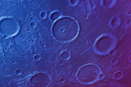 Decorative plaster wall design. Close-up of rough stone concrete wall texture, similar to Moon or asteroid surface. For modern background, pattern, wallpaper or banner designの写真素材