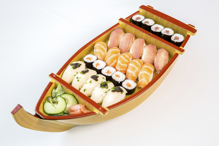 sushi wooden boat on white backgroundの写真素材