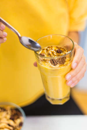 Close up of a healthy fruit drink with nuts