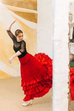 flamenco dancer in balance dancing in a dance studioの写真素材