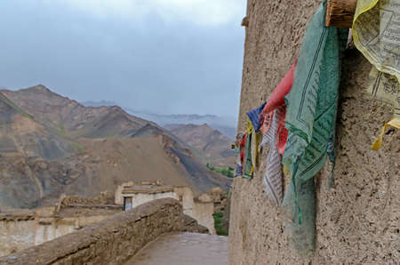 SRINAGAR, INDIA - AUGUST 2, 2017: Buddhist prayer signs in the form of multi colored flags, hangs on the rope in Himalaya, Lamayuru Monastery (Yuru Gompa), Srinagar-Kargil.のeditorial素材