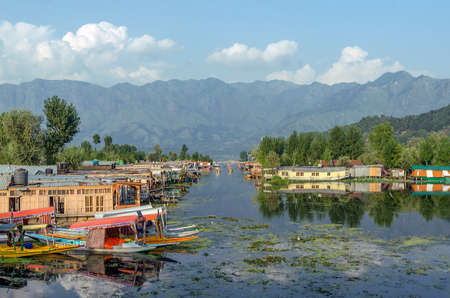 SRINAGAR, INDIA - JULAY 30, 2017: View of Dal Lake in Srinagar with houseboath and sikara. For centuries the Shikaraâs have been serving as the taxi boats of the Dal lake.のeditorial素材