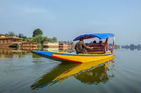 SRINAGAR, INDIA - JULAY 30, 2017: Indian gondolier with a traditional boath. For centuries the Shikaraâs have been serving as the taxi boats of the Dal lake.のeditorial素材