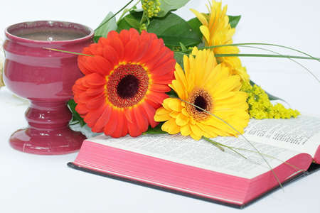 Christian symbols: chalice, flowers and open bible