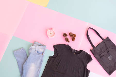 Women's clothing base layout, Outer on pale mint pastel background. Lifestyle concept. alarm clock. small bag. bagの写真素材