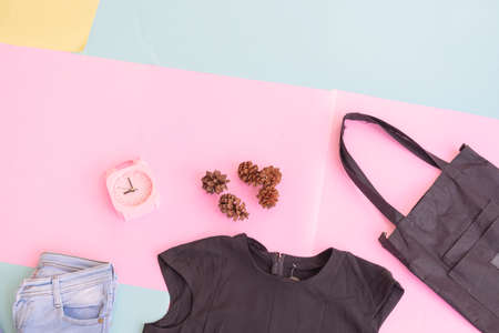 Women's clothing base layout, Outer on pale mint pastel background. Lifestyle concept. alarm clock. small bag. bagの写真素材