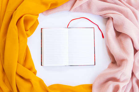 Minimalist Concept. dry leaves, book and pen on white background. Autumn, autumn concept. Flat lay, top view, copy spaceの写真素材