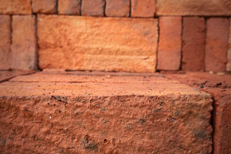 Minimalist concept. Yellow scarf, brown scarf, coffee and green leaves on white background. Fall. Flat lay, top view, copy spaceの写真素材