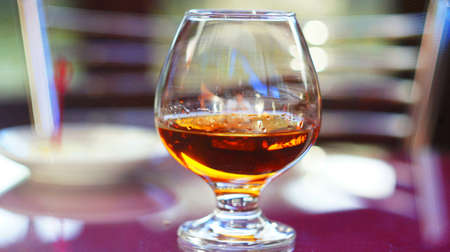 Brandy with lemon. A glass of brandy with slices of lemon, sprinkled with salt and pepper. This is...