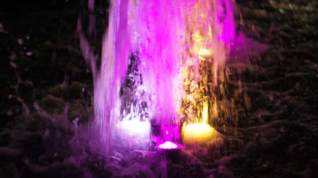 A fountain with color illumination in the evening in the city square "400 anniversary" in Nalchik.の写真素材
