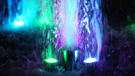 A fountain with color illumination in the evening in the city square "400 anniversary" in Nalchik.の写真素材