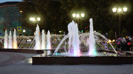 A fountain with color illumination in the evening in the city square "400 anniversary" in Nalchik.のeditorial素材