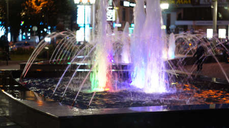 A fountain with color illumination in the evening in the city square "400 anniversary" in Nalchik.の写真素材