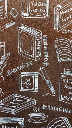Drawings by hand on the theme of books. Figures book on the painted metal surface of the bookcase, which is located a park alley Nalchik. Anyone can take a book from the closet to read while walking in the park.の写真素材