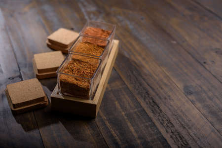 seasoning set on table with spoon and hand servingの写真素材