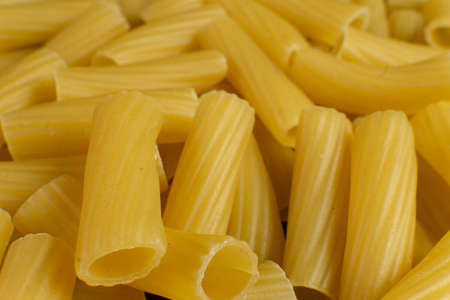 background formed by spiral shaped pastaの写真素材