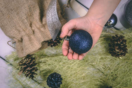 Child holds a handful of pine cones.の写真素材