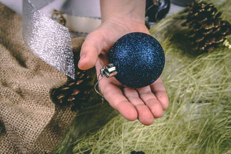Child holds a handful of pine cones.の写真素材