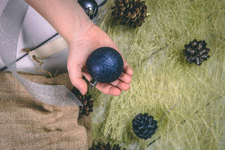 Child holds a handful of pine cones.の写真素材