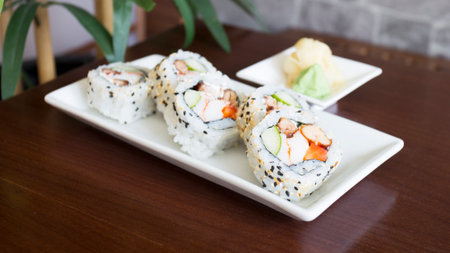 Vegan uramaki. Type of sushi covered with rice on the outside and filled with a combination of vegetables.の写真素材