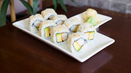 Vegan uramaki. Type of sushi covered with rice on the outside and filled with a combination of vegetables.の写真素材