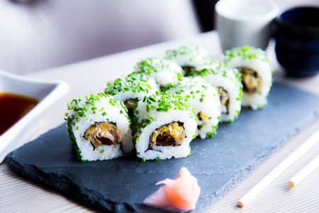 Vegan uramaki. Type of sushi covered with rice on the outside and filled with a combination of vegetables.の写真素材