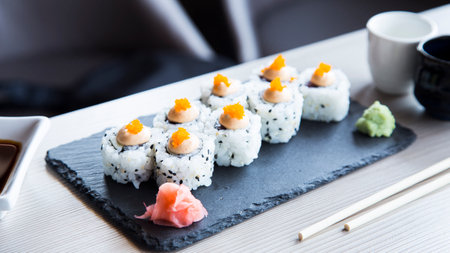 Vegan uramaki. Type of sushi covered with rice on the outside and filled with a combination of vegetables.の写真素材