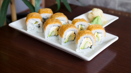 Vegan uramaki. Type of sushi covered with rice on the outside and filled with a combination of vegetables.の写真素材