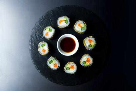 Fried vegan sushi roll with breadcrumbs. Rice roll stuffed with vegetables.の写真素材