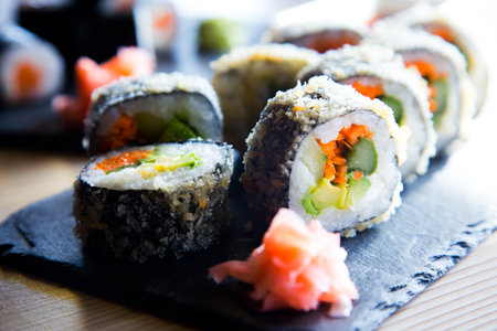 Fried vegan sushi roll with breadcrumbs. Rice roll stuffed with vegetables.の写真素材