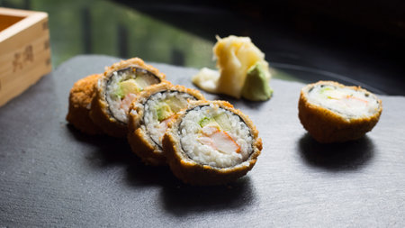 Fried Chicken Sushi Roll with avocado. Modern sushi recipe in Japan.の写真素材