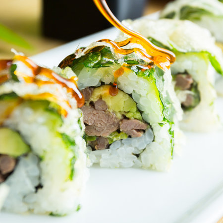 Sushi roll with chicken and vegetables served in a Tokyo restaurant.の写真素材