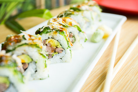 Sushi roll with chicken and vegetables served in a Tokyo restaurant.の写真素材