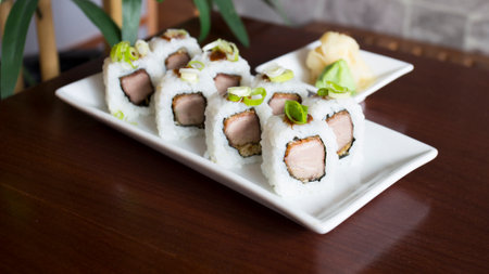 Sushi roll with chicken and vegetables served in a Tokyo restaurant.の写真素材