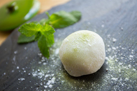 Mochi is a Japanese cake made from mochigome, a small glutinous grain of rice. The rice is pounded into a paste and molded into the desired shape.の写真素材