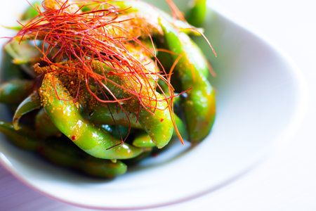 Edamame is a preparation of immature soybeans in the pod, found in cuisines with origins in East...