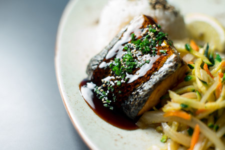 Salmon cooked with teriyaki sauce. Traditional Japanese recipe.の写真素材