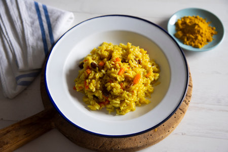 Curry rice with vegetables and raisins. Recipe to accompany main meat or fish dishes.の写真素材
