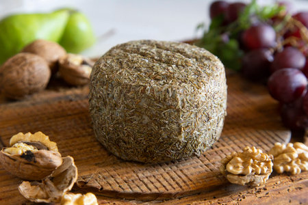 High quality organic and artisan Spanish premium cheese. Product on wooden table.の写真素材