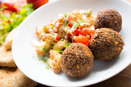 Dish with Falafel. Falafel is a chickpea or broad bean croquette. Middle East Gastronomy.