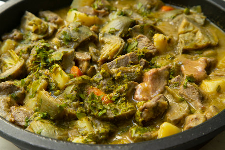 Braised beef with potatoes and artichokes.の写真素材
