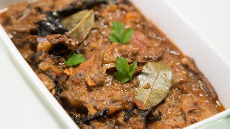 Fricando Veal cooked with sauce, vegetables and mushrooms. Typical Spanish tapas recipe.の写真素材