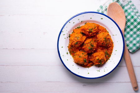 Meatballs with tomato sauce and vegetables. Traditional Spanish cover.の写真素材