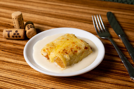 Cannelloni pasta stuffed with meat, vegetables and spinach gratin in the oven. Traditional Christmas recipe in Spain.の写真素材