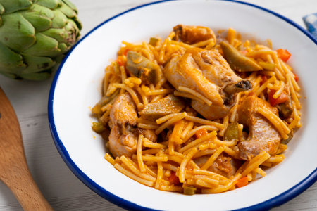 Recipe Fideua with rabbit. Casserole noodles with meat. Traditional Spanish cover.の写真素材