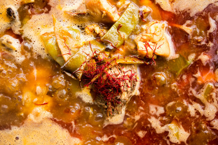 Cooking the authentic Valencian Spanish paella with chicken and rabbit.の写真素材