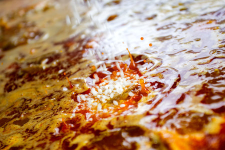 Cooking the authentic Valencian Spanish paella with chicken and rabbit.の写真素材