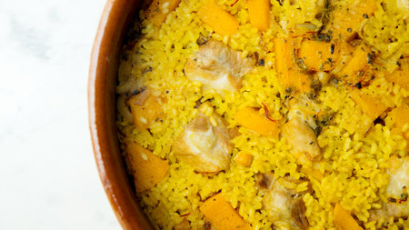 Baked rice paella with pork rib, pumpkin vegetables.の写真素材